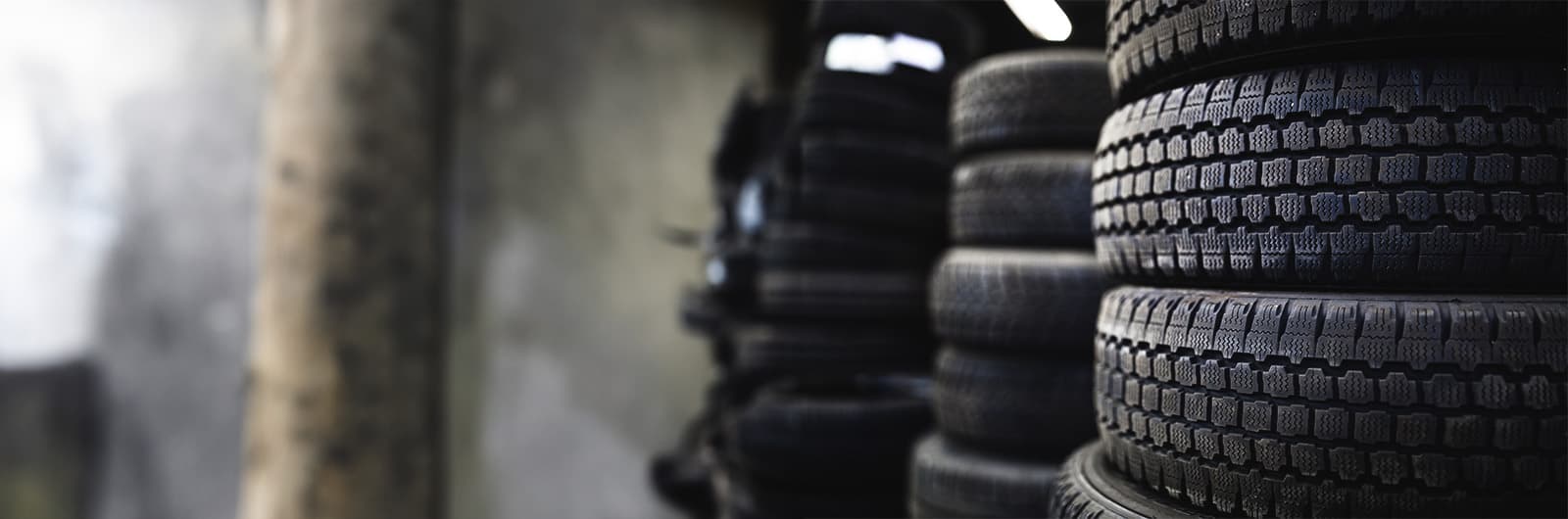 tires stacked against wall